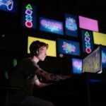 A focused gamer plays e-sports in a neon-lit room, surrounded by digital screens.